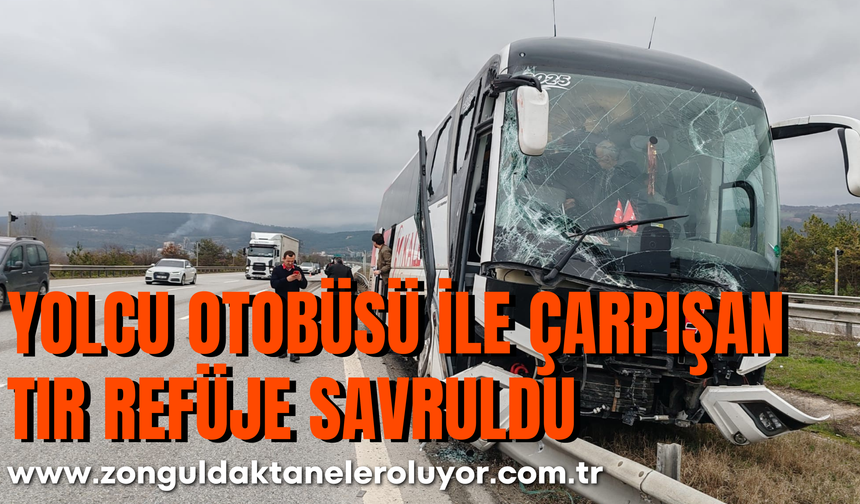 yolcu otobüsü ile çarpışan tır refüje savruldu